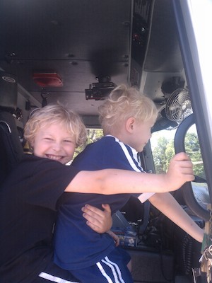 IMG_20110604_123917 - Tim and Cole in a fire truck (06-04-2011 12:39)