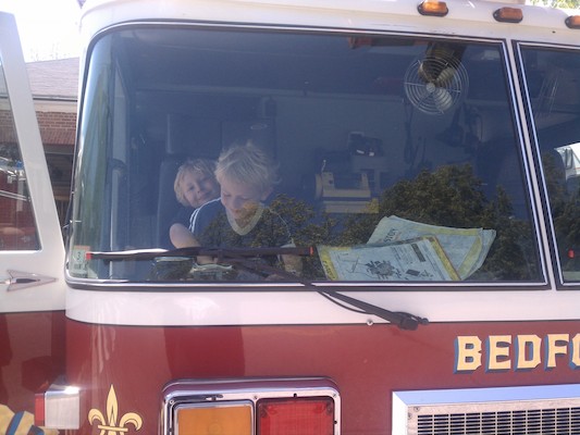 IMG_20110604_123930 - Tim and Cole in a fire truck (06-04-2011 12:39)