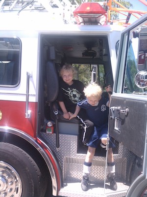IMG_20110604_123939 - Tim and Cole in a fire truck (06-04-2011 12:39)