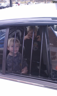 IMAG0633 - Cole and Tim in a police car (03-19-2011 13:31)