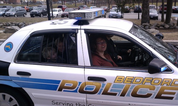 IMAG0634 - Xine, Cole and Tim in a police car (03-19-2011 13:31)