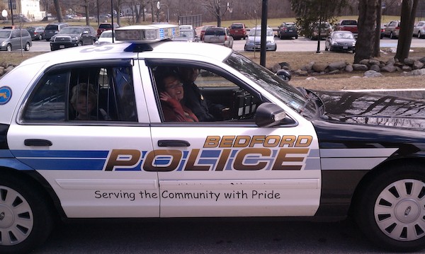 IMAG0635 - Xine, Cole and Tim in a police car (03-19-2011 13:32)