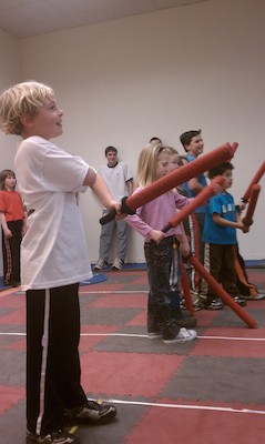 IMAG0653 - Tim swordfighting at Nathan's party (04-10-2011 16:25)