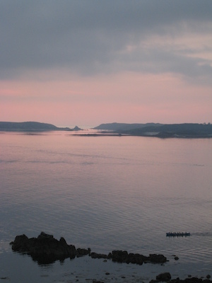 Gig racers row home in front of Bryher and Tresco at sunset (07-13-2011 21:24)