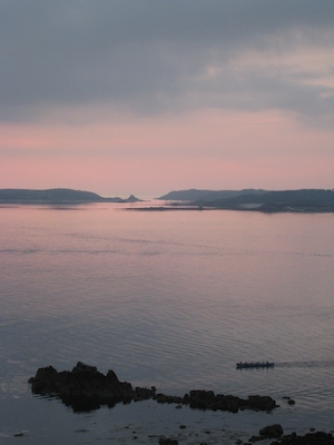 Gig racers row home in front of Bryher and Tresco at sunset (07-13-2011 21:25)