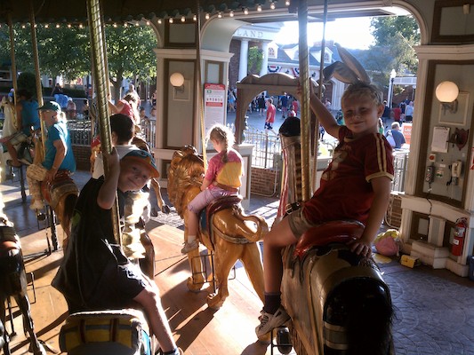 Cole and Bugs Tim on the Merry-go-round (07-30-2011 18:40)