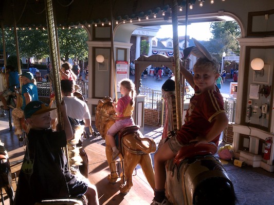 Cole and Bugs Tim on the Merry-go-round (07-30-2011 18:40)