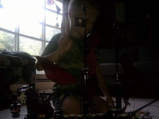 Cole building the Lego Queen Anne's Revenge (08-13-2011 08:19)