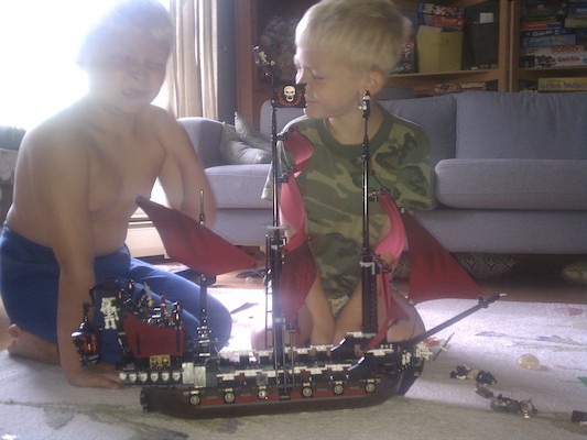 Tim and Cole building the Lego Queen Anne's Revenge (08-13-2011 08:20)