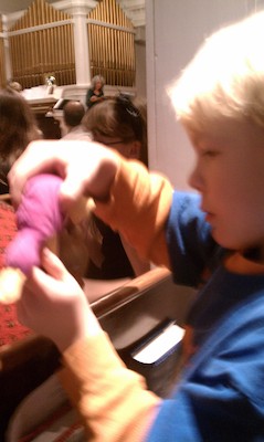 Cole with a platypus for the manger (12-24-2010 16:33)