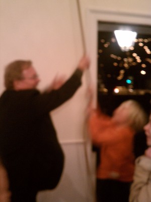 John and Tim ringing the bell (12-24-2011 17:16)