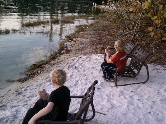 Cole and Tim eating sandwiches at the Universal resort (02-21-2012 17:58)
