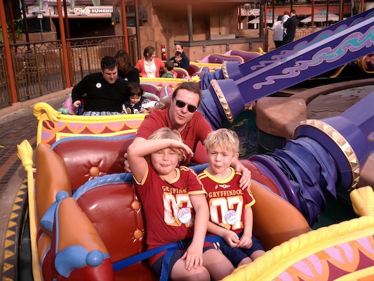 Tim, Ben and Cole riding the carpets at Disney World (02-25-2012 09:23)