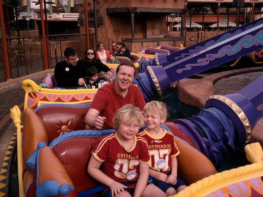 Tim, Ben and Cole riding the carpets at Disney World (02-25-2012 09:23)