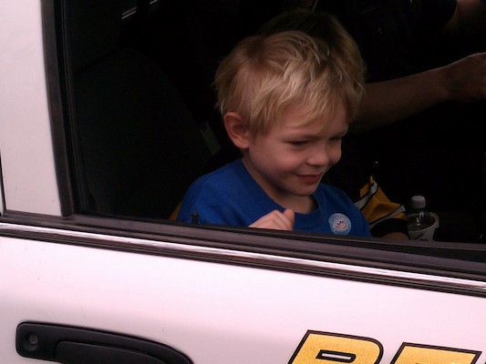 Cole and Tim in the police car (03-24-2012 15:18)