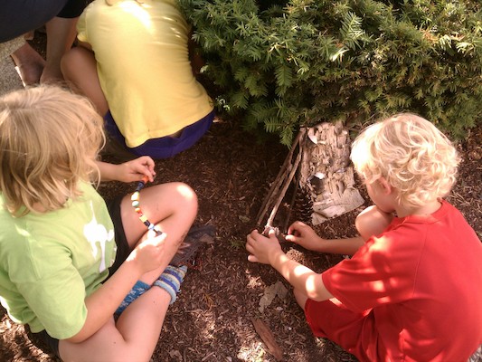 Tim and Cole making fairy houses (07-03-2012 15:54)