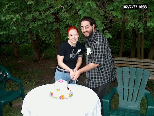 Beth and Corey cutting cake