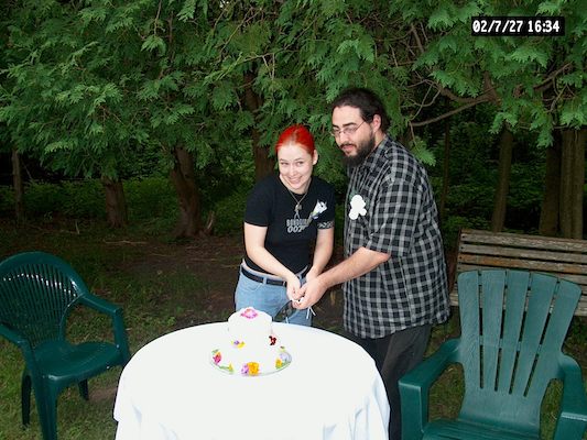 Beth and Corey cutting cake