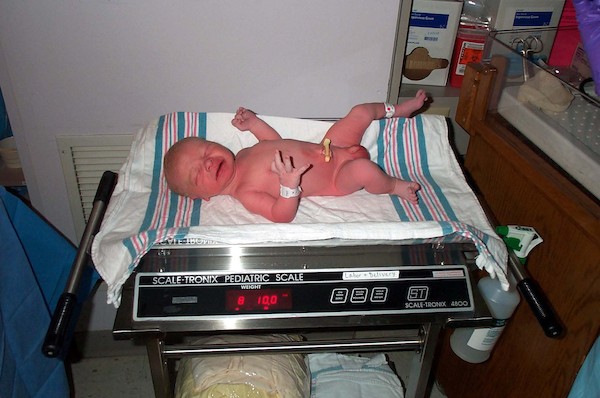 Weighing the baby (3-1-03 6:15AM)
