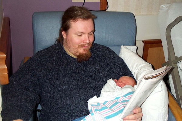 Tim helping dad read (3-1-03)