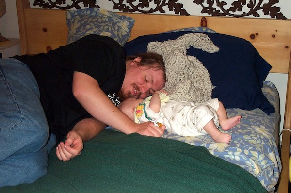 Cuddling on the bed (5-29-03 7:51PM)