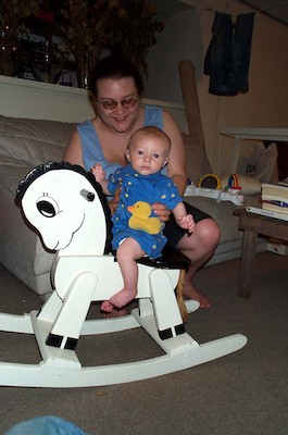 Tim on rocking horse (7-2-2003 7:12PM)