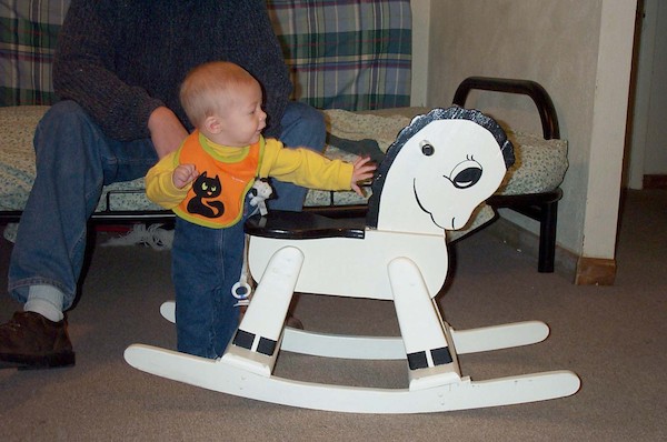Tim next to rocking horse (10-4-2003 8:58AM)