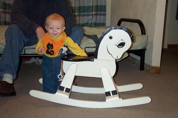 Tim next to rocking horse (10-4-2003 8:59AM)
