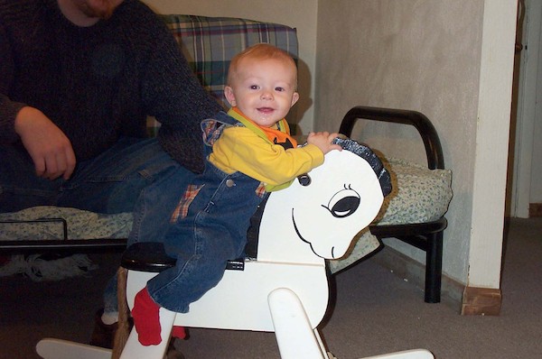 Tim riding the rocking horse (10-4-2003 8:59AM)