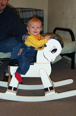 Tim riding the rocking horse (10-4-2003 8:59AM)