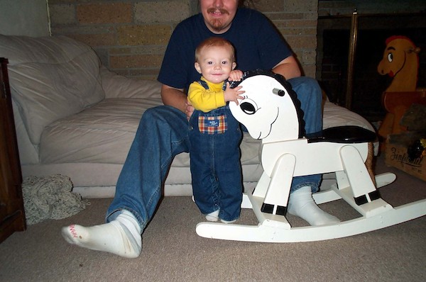 Tim next to rocking horse (11-2-2003 18:10)