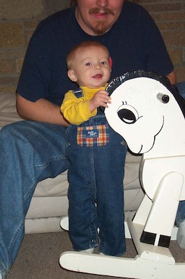 Tim next to rocking horse (11-2-2003 18:11)