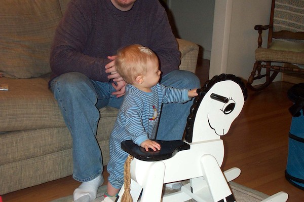 Tim next to Rocking Horse (1-1-2004 18:42)