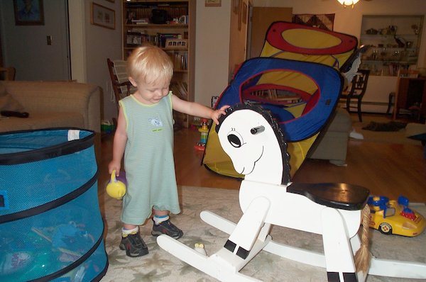 Tim with rocking horse (2004-07-04 19:04:56)