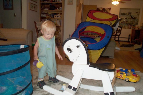 Tim with rocking horse (2004-07-04 19:05:02)