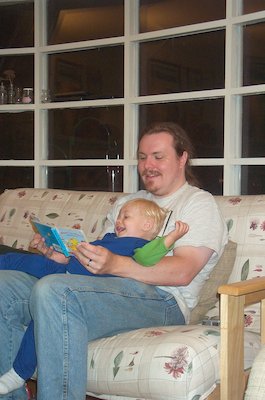Tim reading with Daddy (8-7-2004 20:30)