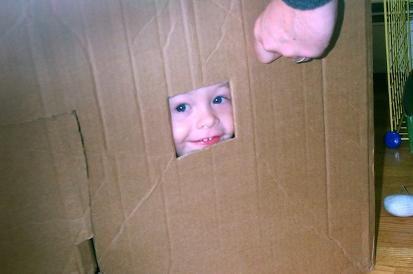 Tim peeping from cardboard house (03-19-2005 15:20)