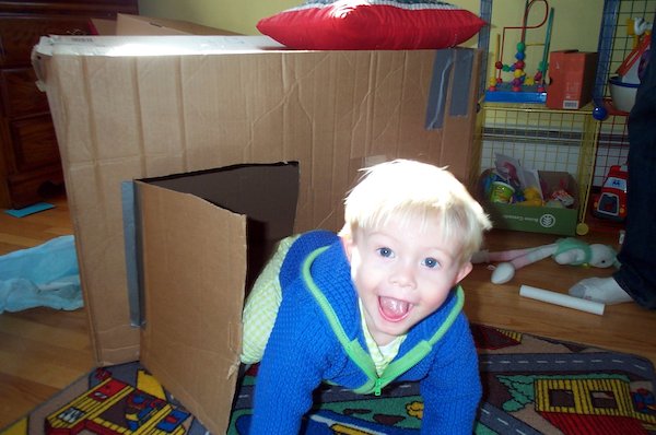 Tim emerging from cardboard house (03-19-2005 15:20)
