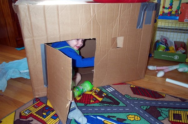 Tim reentering the cardboard house (03-19-2005 15:20)
