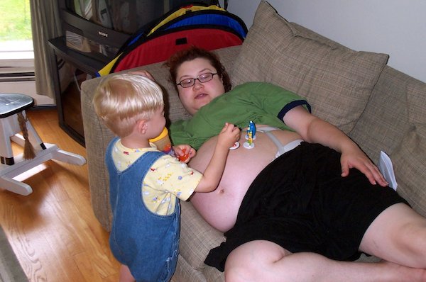 Tim playing on baby brother (06-05-2005 16:13)