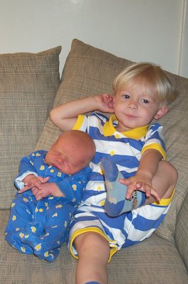 Tim and Nicholas cuddling on the couch (06-19-2005 08:56)