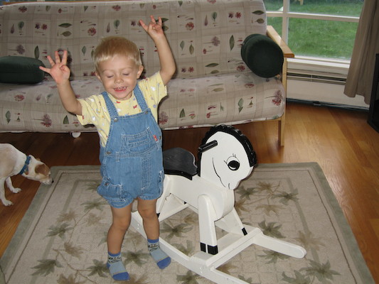 Tim next to rocking horse (and Emily) (09-04-2005 09:41)