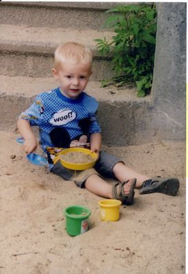 Tim playing in sand