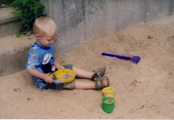 Tim playing in sand