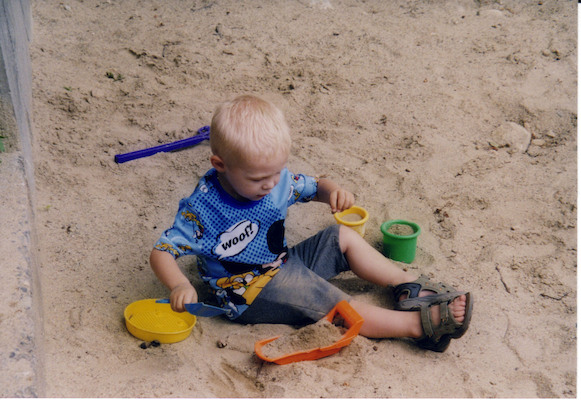 Tim playing in sand