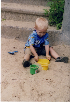Tim playing in sand