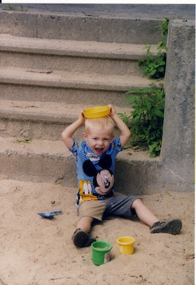 Tim playing with sand hat