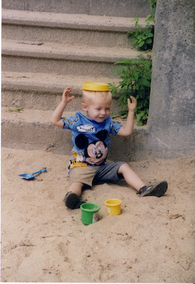 Tim playing with sand hat