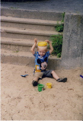 Tim playing with sand hat